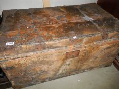 An old hide covered cabin trunk.