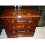 A small pitch pine chest with 4 drawers advertising cottons and bobbins and threads