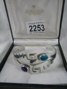 A silver bracelet marked 925