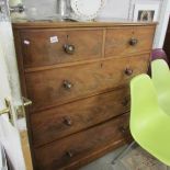 a 2 over 2 mahogany chest of drawers.