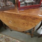 An oak gate leg table.