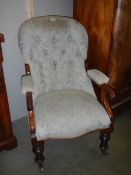 A Victorian mahogany framed gentleman's chair.