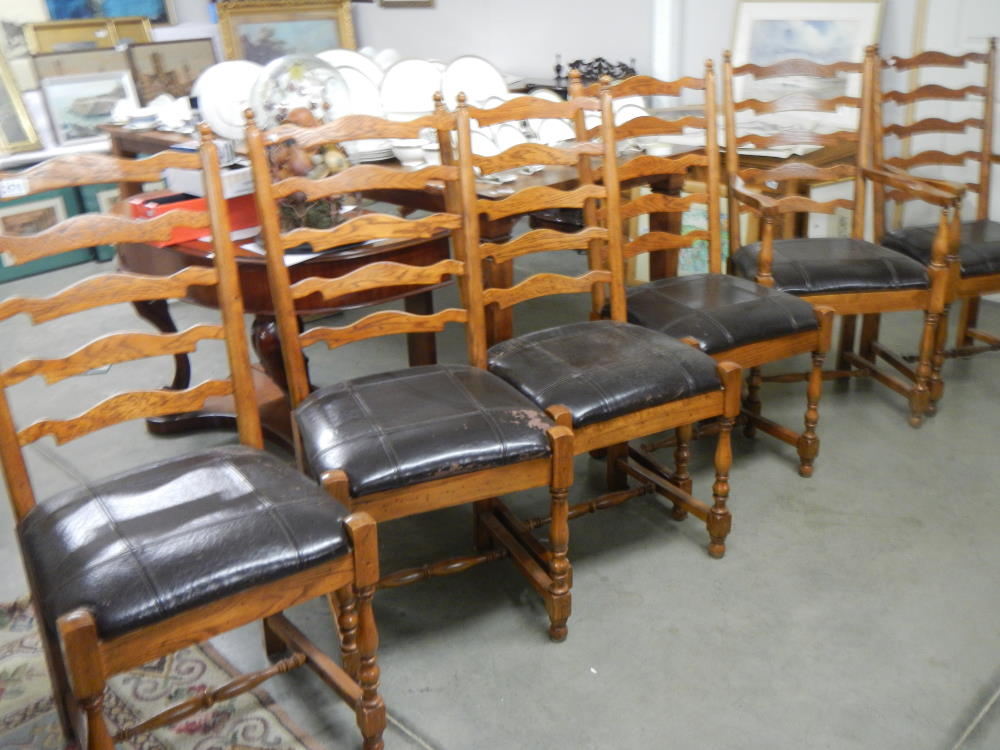 A good set of 6 oak ladder back chairs comprising 2 carvers and 4 diners.