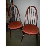 A pair of Ercol style chairs.