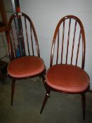 A pair of Ercol style chairs.