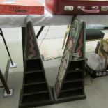A pair of hand painted pyramid shaped display shelves.