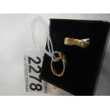 A pair of 2 tone yellow and white gold earrings.