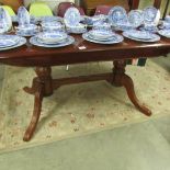 A mahogany extending dining table.