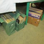 A box and 2 bags of assorted LP records.