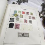 3 stock books / albums of British stamps mostly Elizabeth II but also including other monarchs.