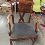 An oak elbow chair.