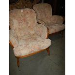 A pair of arm chairs.