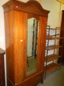 An Edwardian inlaid mirror door wardrobe.