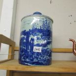 A large blue and white lidded jar.