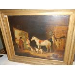 A gilt framed oil on canvas stable scene.