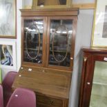 An inlaid bureau bookcase.