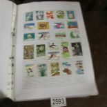 £ stamp folders containing a good selection of world stamps.