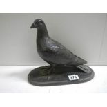 A model of a pigeon signed T Rynharl, in a bronze coloured finish.