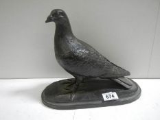 A model of a pigeon signed T Rynharl, in a bronze coloured finish.