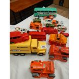 A box of plastic and metal toy vehicles.