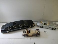 A model Mercedes 300SL (bonnet catch missing), A Mercedes SK and a Sunstar Lincoln Limousine.