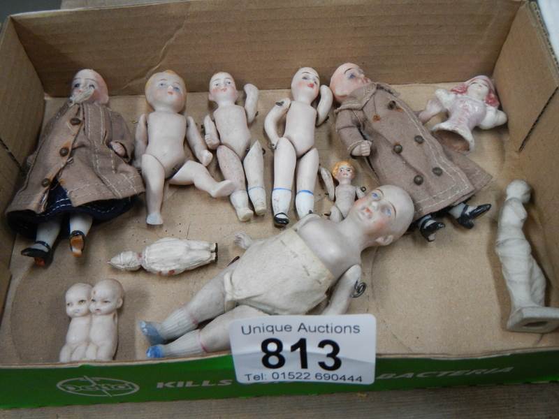 6 small old porcelain dolls and other items.