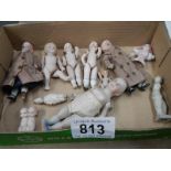 6 small old porcelain dolls and other items.