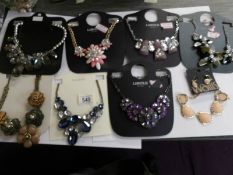 8 various design costume necklaces.