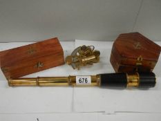 A brass 3 drawer 20th century telescope and a small cased sextant.