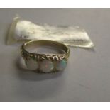 A 3 stone opal ring set in 9ct yellow gold.