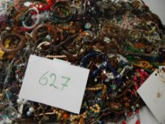 A very large collection of unsorted costume jewellery (crate not included)