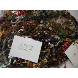 A very large collection of unsorted costume jewellery (crate not included)