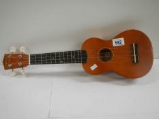 A small modern Makalo 4 string ukelele.