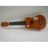 A small modern Makalo 4 string ukelele.