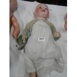 A Victorian dressed porcelain doll, needs wig, 30" tall.