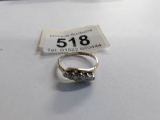 A circa 1940's diamond five stone twist ring in 9ct gold and platinum, size M.