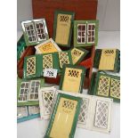 A good lot of vintage metal dolls house doors and windows.