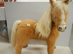 A battery operated pony, 36" tall.