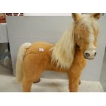 A battery operated pony, 36" tall.