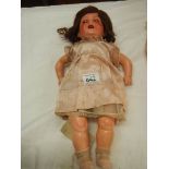 A Victorian porcelain headed doll, missing wig, 17".