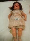 A Victorian porcelain headed doll, missing wig, 17".