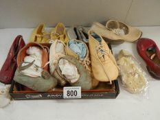 A quantity of vintage dolls shoes.
