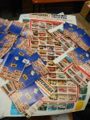 A box of 1983 and 1986 Matchbox toy catalogues and some product posters.