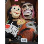 A box containing vintage children's masks.