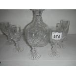 A good quality cut glass decanter and 6 glasses, in good condition.