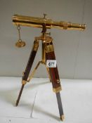 A 20th century brass telescope on adjustable stand, height 15".