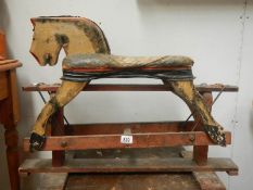 A 1950's wooden rocking horse.