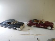 A 1947 model Cadillac series 621-18 and a 1953 model Cadillac Eldorado.