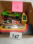 A box containing Corgi 163 custom car and other models.