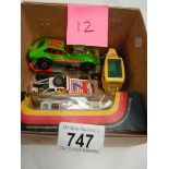 A box containing Corgi 163 custom car and other models.